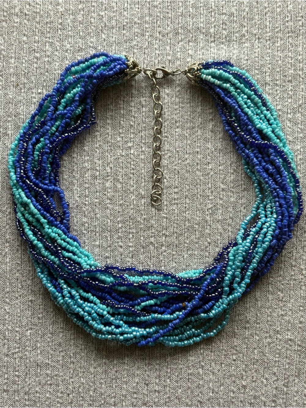 Bohemian theme multistranded dark & light blue microbeaded adjustable necklace